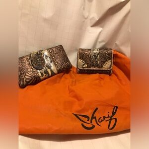 Sharif leather embossed satchel with two matching wallets. Like new.  Earth tone